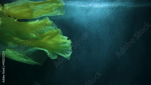 beautiful girl in colorful dresses under the water