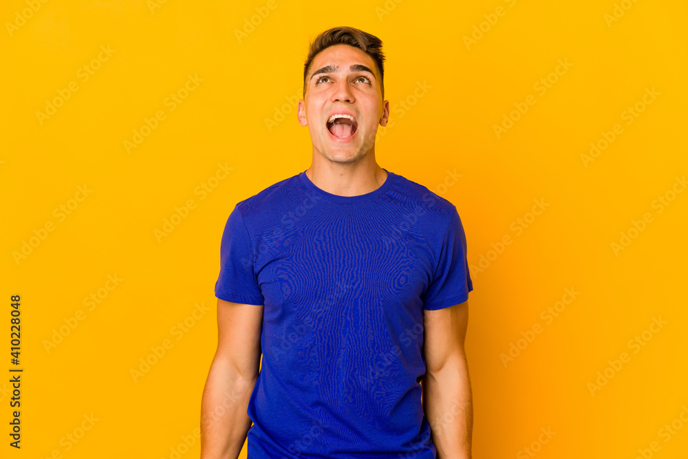 Young handsome caucasian man isolated shouting very angry, rage concept, frustrated. Young handsome caucasian man isolated shouting very angry, rage concept, frustrated.