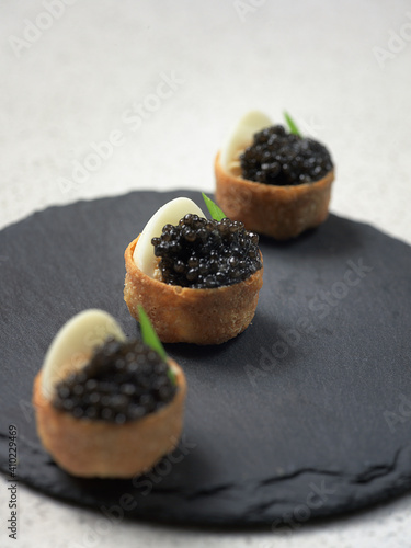 tartalett with black caviar plate