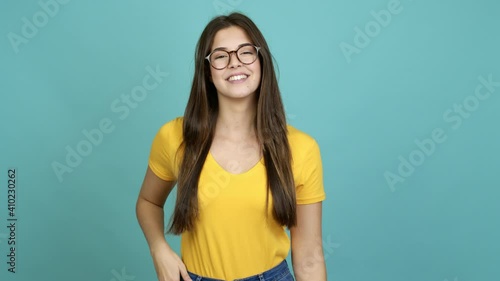 Teenager Brazilian girl with glasses smiling over isolated background
