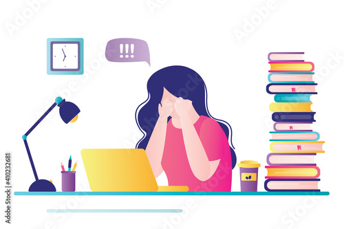Young girl sits at workplace and cries. Cute woman has learning problems. Female student gets upset and worried about university