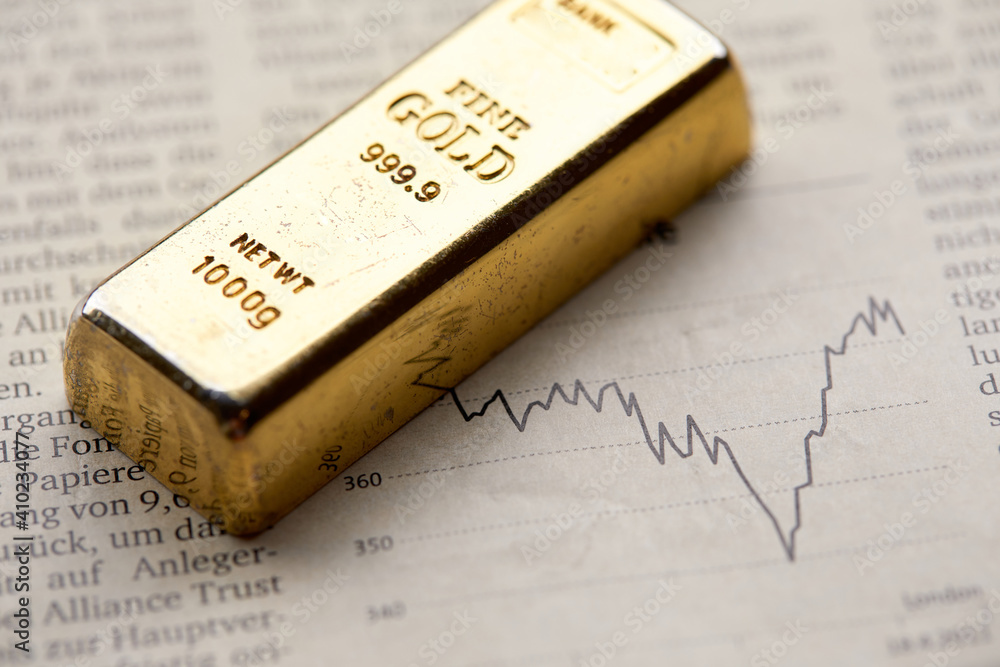 Gold bullion on the graph as crisis safe haven, financial asset, investment and wealth concept... Gold bullion on the graph as crisis safe haven, financial asset, investment and wealth concept...