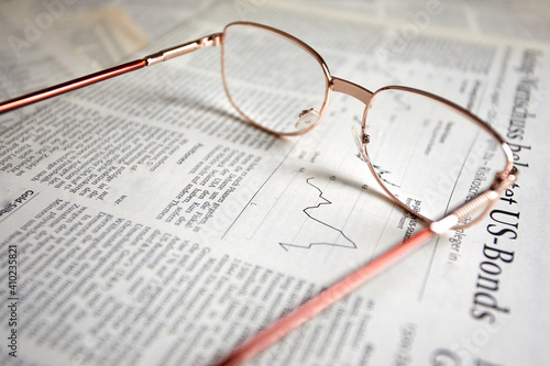 eyeglasses on the newspaper pages
