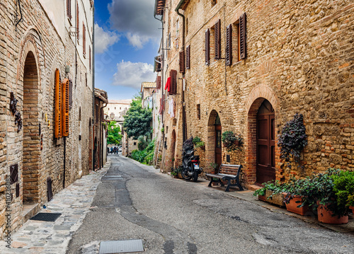 Fototapeta Naklejka Na Ścianę i Meble -  Old street in San Gimignano, Tuscany, Italy. San Gimignano is typical Tuscan medieval town in Italy