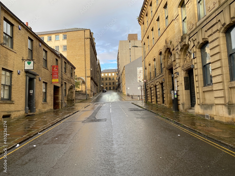 View along, Chapel Street, with Victorian Sandstone buildings, on a wet day in, Little Germany, Bradford, UK