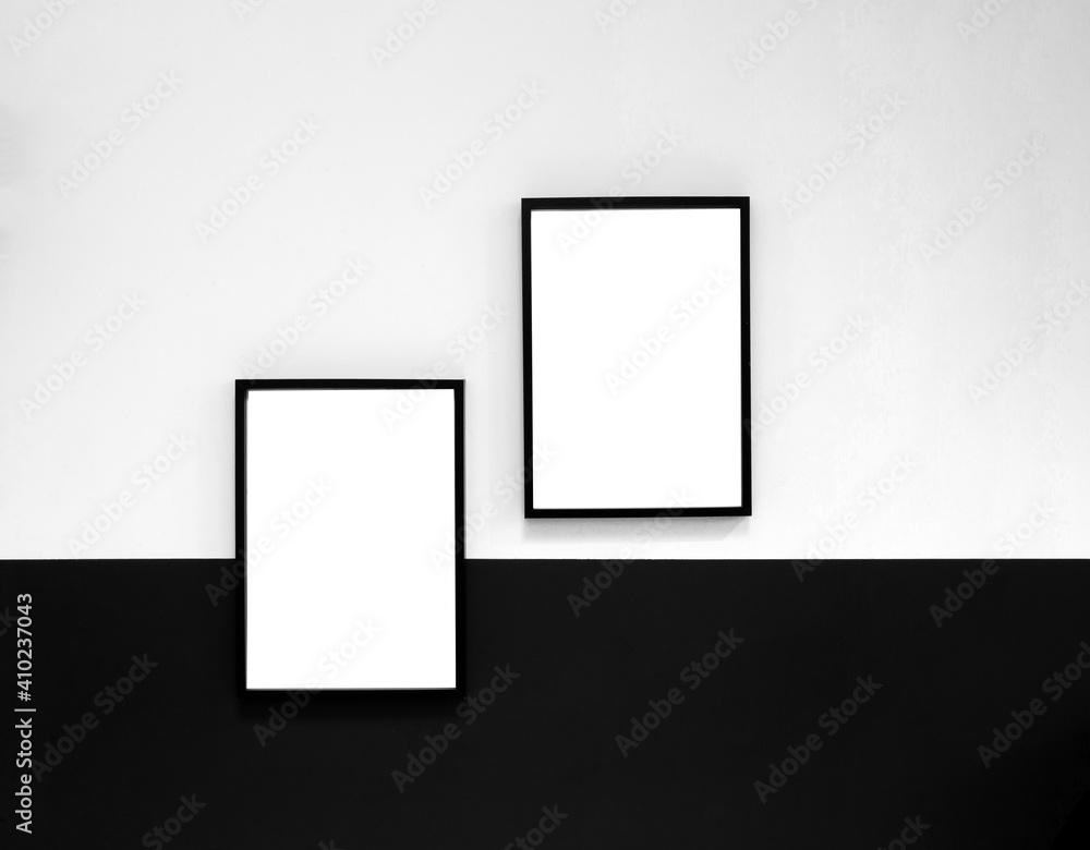 Two blank Poster,canvas,frame hanging on black and white wall, interior design modern mock up frames copy space, Two blank Poster,canvas,frame hanging on black and white wall, interior design modern mock up frames copy space,