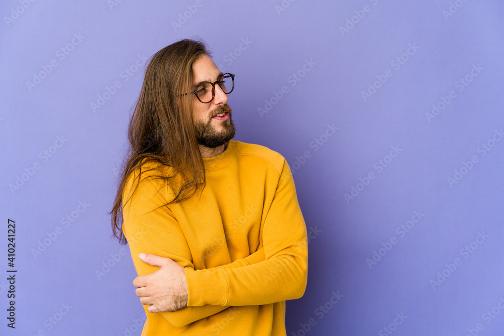 Young man with long hair look smiling confident with crossed arms. Young man with long hair look smiling confident with crossed arms.