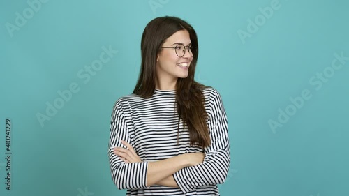 Teenager Brazilian girl with glasses looking side over isolated background