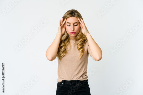 Young caucasian blonde woman touching temples and having headache.