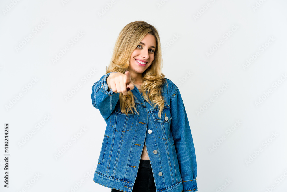 Young caucasian blonde woman cheerful smiles pointing to front. Young caucasian blonde woman cheerful smiles pointing to front.