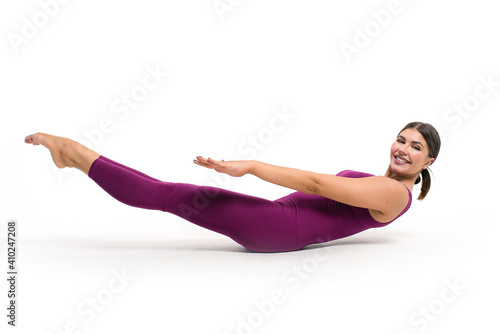 Beautiful athletic woman gymnast in sportswear doing fitness exercises on a white background