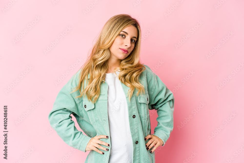 Young caucasian blonde woman confident keeping hands on hips. Young caucasian blonde woman confident keeping hands on hips.
