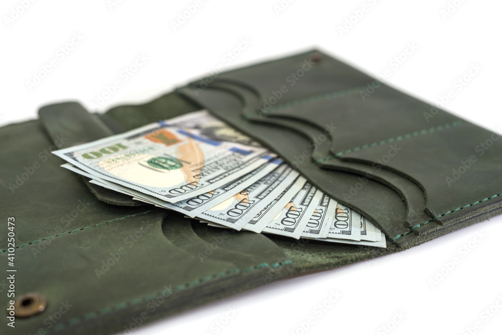 Close-up of an open female wallet with dollars inside. Close-up of an open female wallet with dollars inside.