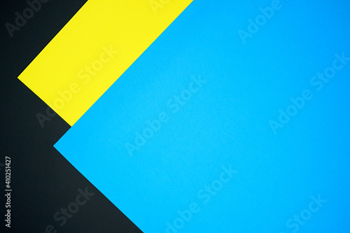Blue, black and yellow three tone color paper background with stripes. Abstract background modern hipster futuristic. Texture design