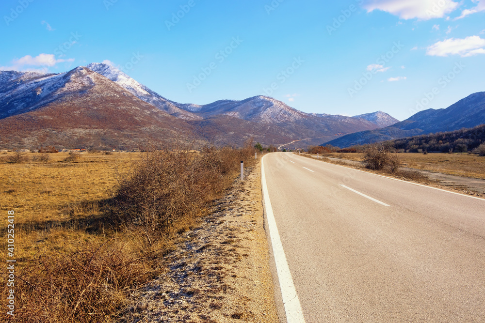 Road trip through the Balkans. Winter landscape with road in valley of Dinaric Alps.  Bosnia and Herzegovina, Republika Srpska