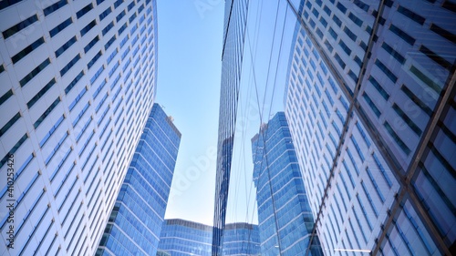 Wallpaper Mural Glass facade of the buildings with a blue sky. Skyscrapers in the business city center.. Background of modern glass buildings.  Torontodigital.ca