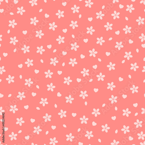 Seamless pattern with pink sakura flowers and petals on salmon background. Ornament with asian blossoms and hearts on a coral texture. Cute endless motive with flowers and hearts.