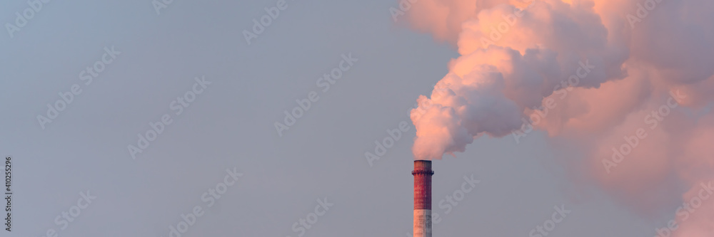 Factory smoke pipes pollute atmosphere with smoke ecology pollution, Industrial factory chimney pollutes. Wide banner