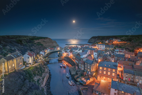 Moonrise over the North Yorkshire fishing village of Staithes. photo