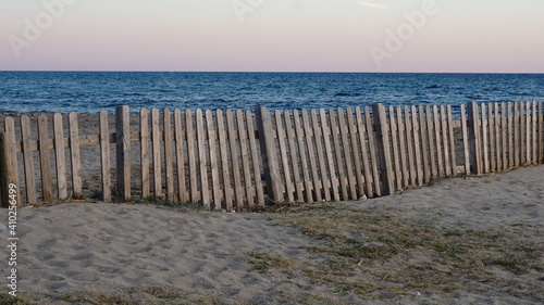 rustic wooden fence by the sea
