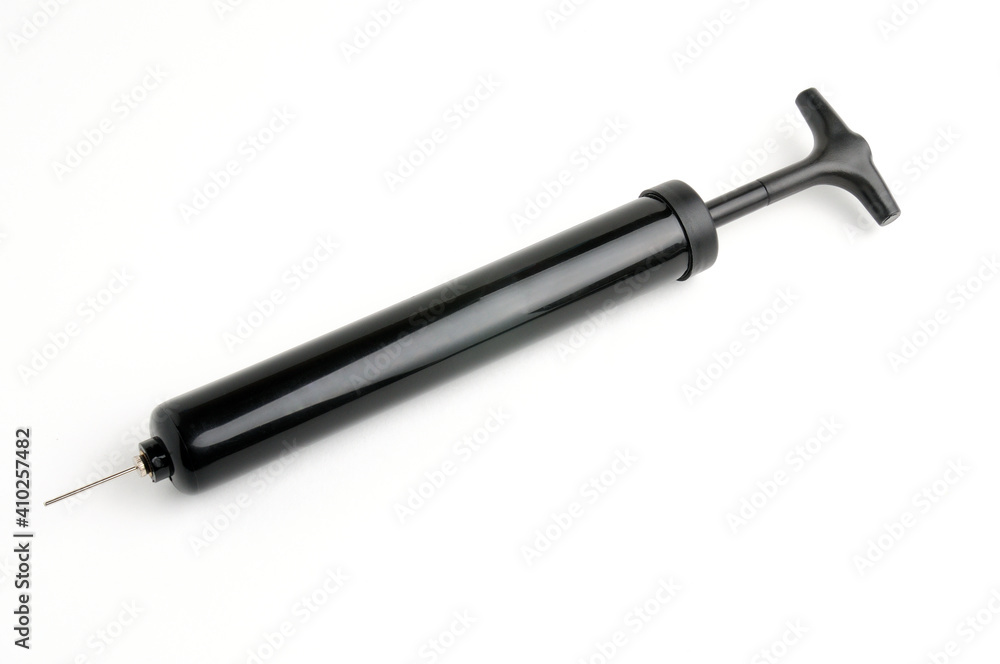 Pump and needle for pumping air on a white background Pump and needle for pumping air on a white background