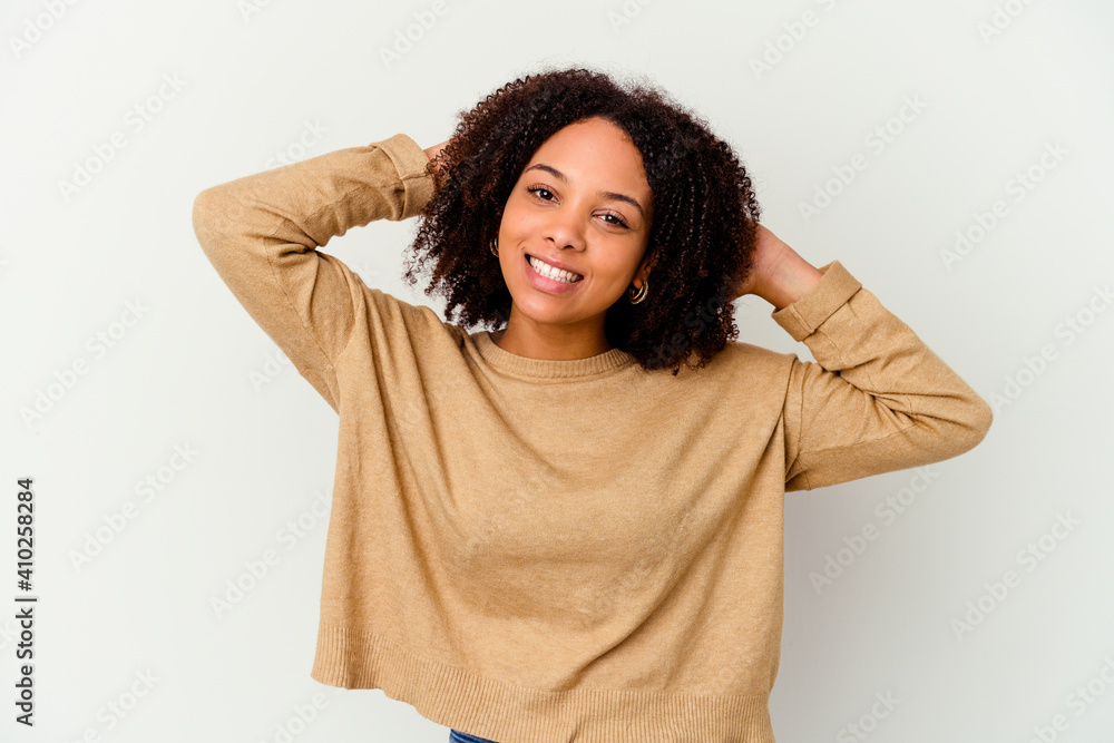 Young african american mixed race woman isolated stretching arms, relaxed position. Young african american mixed race woman isolated stretching arms, relaxed position.