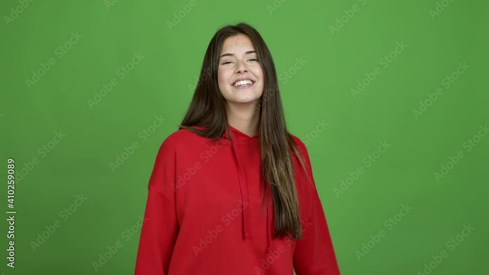 Teenager Brazilian girl intending to realizes the solution while lifting a finger up over isolated background. Green screen chroma key video Teenager Brazilian girl intending to realizes the solution while lifting a finger up over isolated background. Green screen chroma key video