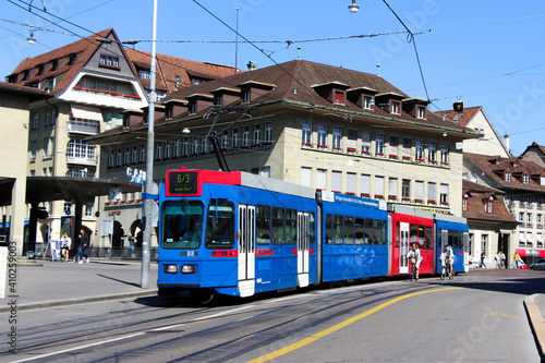 Tram in Bern Switzerland, public transport train red and blue
