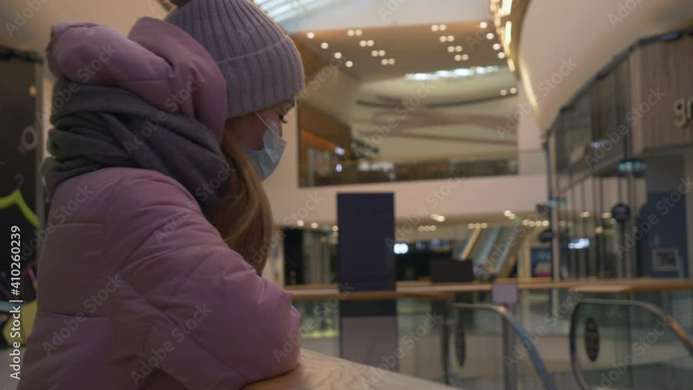 Young girl in face mask in City Mall Young girl in face mask in City Mall