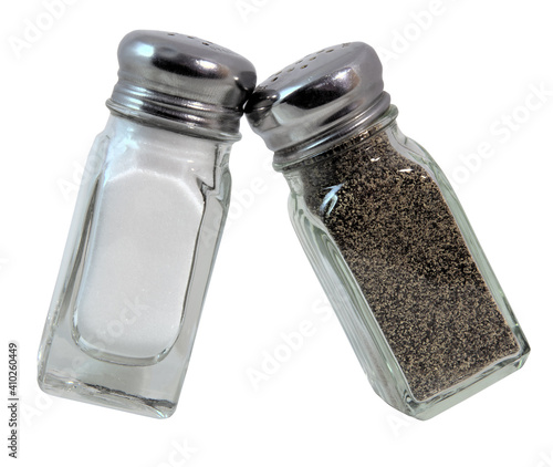 Isolated glass salt and pepper shakers.