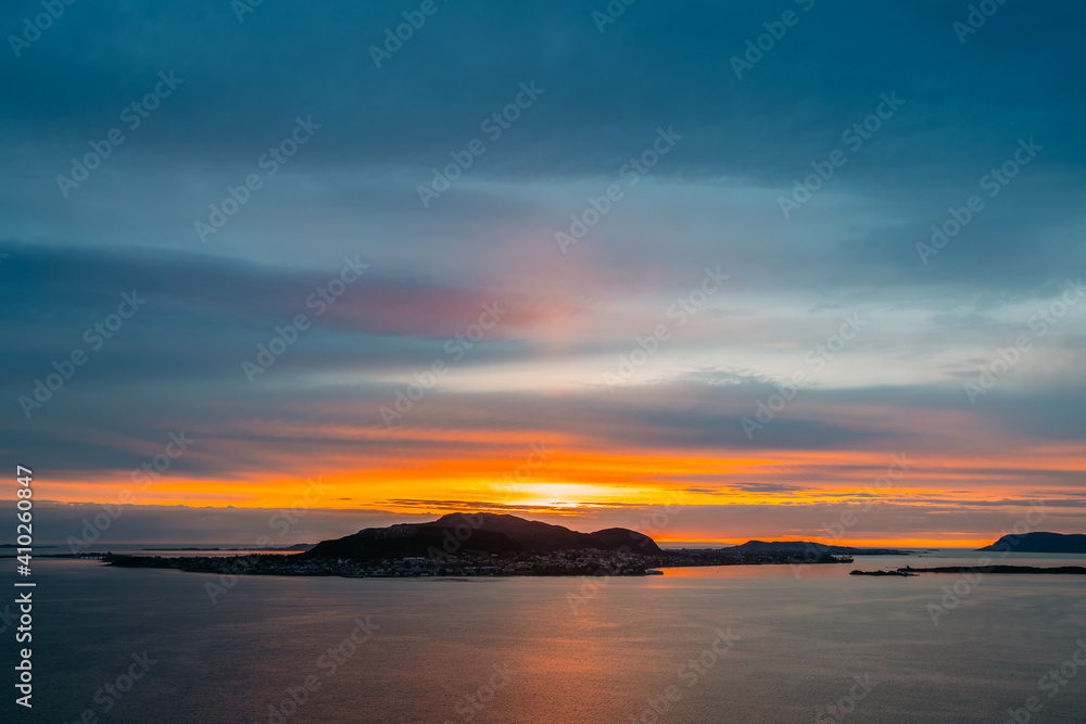 Fototapeta premium Alesund, Norway. Amazing Natural Bright Dramatic Sky Above Alesund Valderoya And Islands In Sunset Time. Colorful Sky Background. Beauty In Norwegian Nature