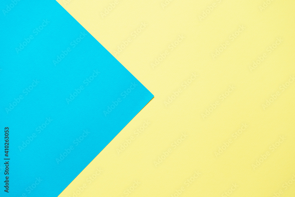 Blue and yellow two tone color paper background. Abstract background modern hipster futuristic. Texture design Blue and yellow two tone color paper background. Abstract background modern hipster futuristic. Texture design