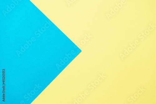 Blue and yellow two tone color paper background. Abstract background modern hipster futuristic. Texture design