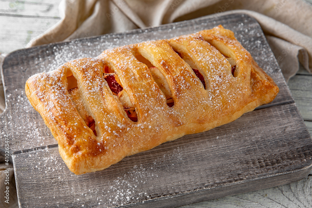 Puff pastry bun stuffed with apples, berries, or cottage cheese and potatoes, mini pie. Bakery products. Sweet pastry. Puff pastry bun stuffed with apples, berries, or cottage cheese and potatoes, mini pie. Bakery products. Sweet pastry.