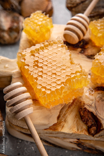 Honey comb. A useful fortified bee product for health and beauty. Vegetarian dietary organic product. Beautiful still life.