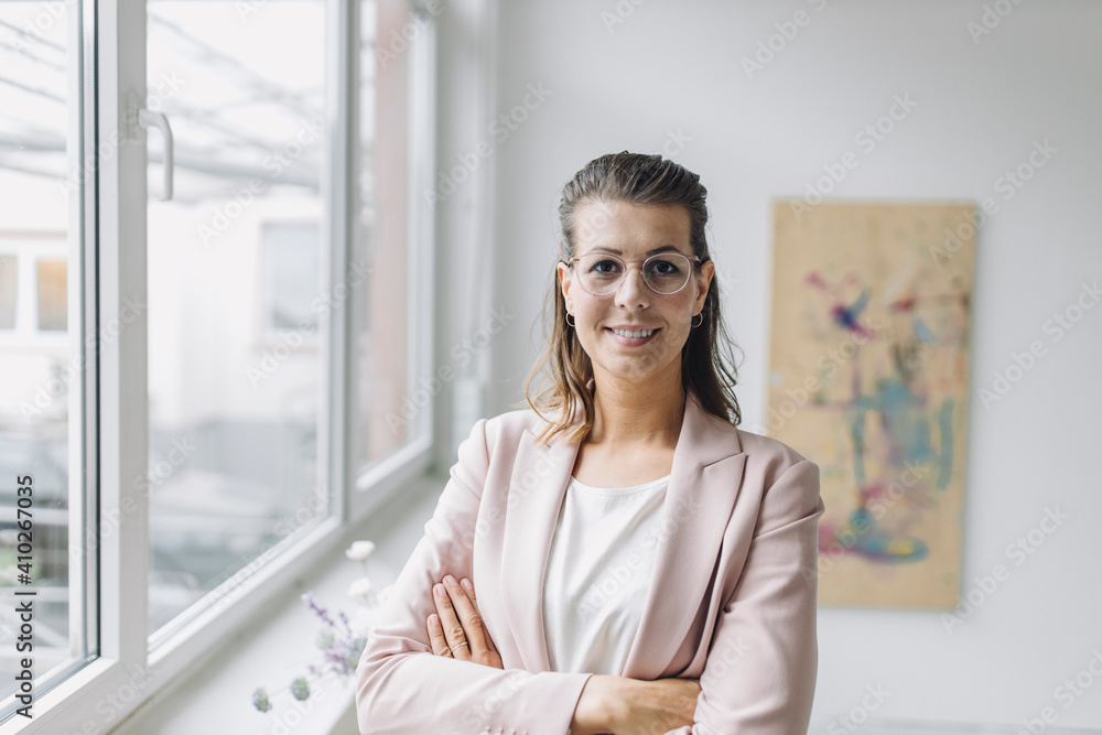 Portrait of smiling businesswoman in office Portrait of smiling businesswoman in office