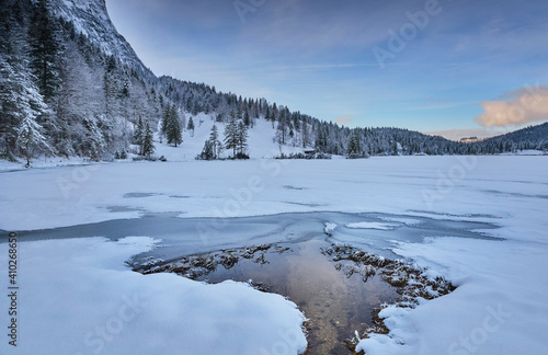 Wallpaper Mural Stream in middle of snow covered land by mountains against sky Torontodigital.ca
