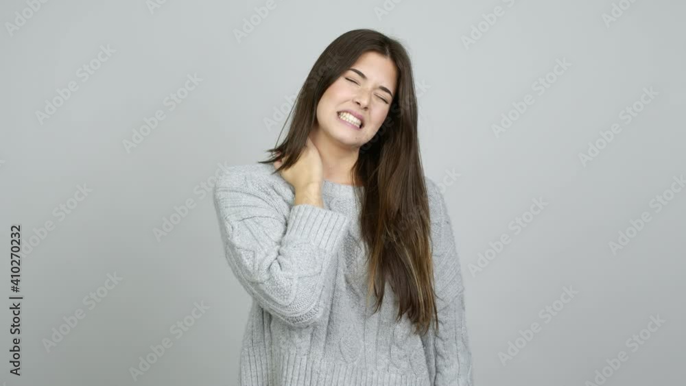 Teenager Brazilian girl with neck pain over isolated background Teenager Brazilian girl with neck pain over isolated background