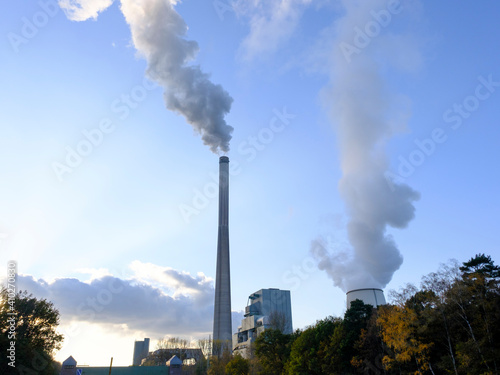 Germany, North Rhine-Westphalia, Bergkamen, Smoke rising from coal-fired power station at sunset photo