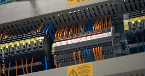 Electrical panel with many wires, electrical parts, automatic switches, breakers, residual current devices, fuses, terminals 