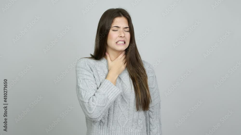 Teenager Brazilian girl with sore throat over isolated background Teenager Brazilian girl with sore throat over isolated background