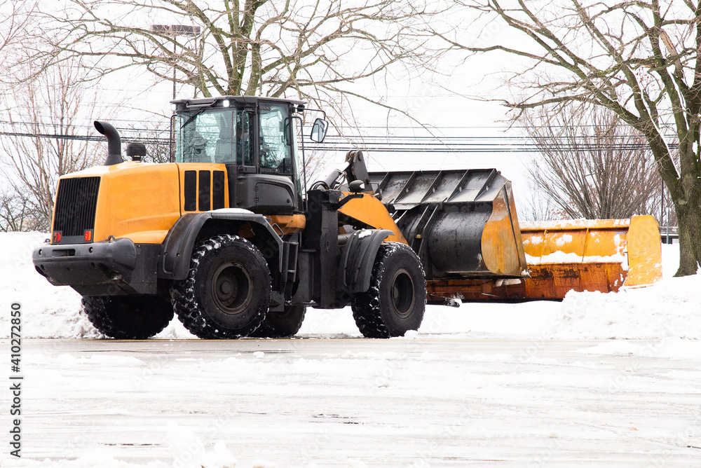 the yellow tractor removes the snow the yellow tractor removes the snow