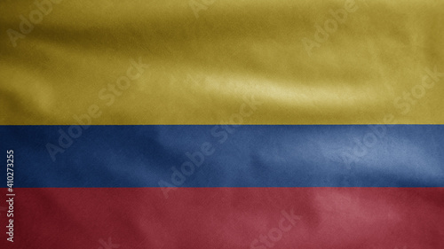 Colombian flag waving in the wind. Close up of Colombia banner blowing soft silk