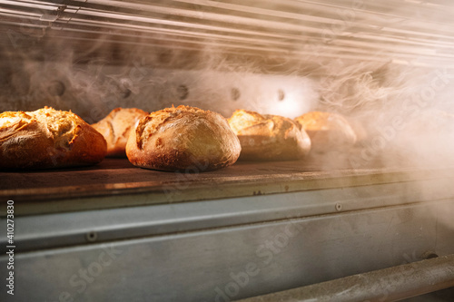 Breads in oven at bakery photo