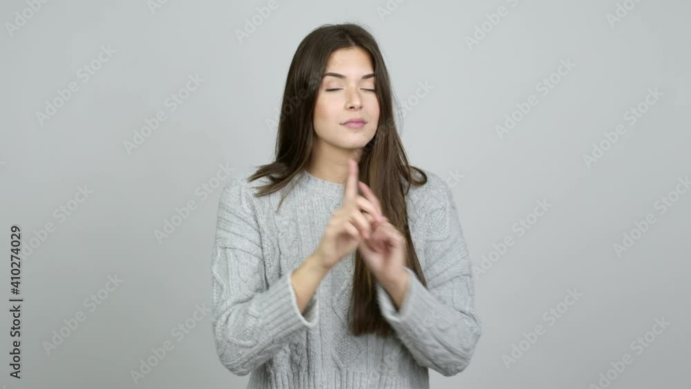 Teenager Brazilian girl doing silence gesture over isolated background Teenager Brazilian girl doing silence gesture over isolated background