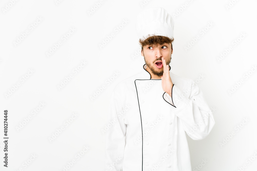 Young arab cook man is saying a secret hot braking news and looking aside Young arab cook man is saying a secret hot braking news and looking aside