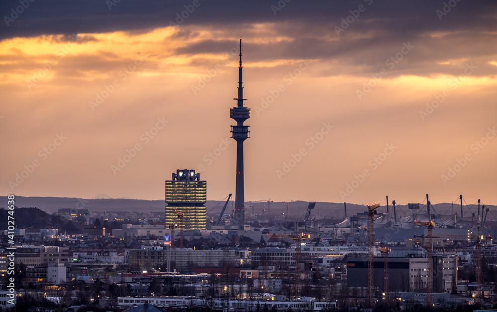 Munich cityscape view of olympia park downtown at sunset colored sky germany.