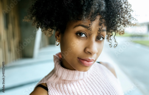 Close-up of beautiful woman with afro hair photo
