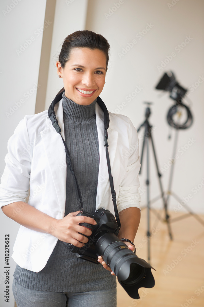 Portrait of woman with digital camera Portrait of woman with digital camera
