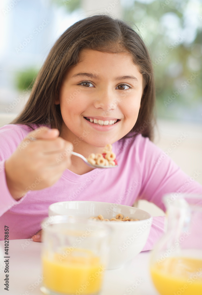 Girl (10-11) having cereals for breakfast Girl (10-11) having cereals for breakfast